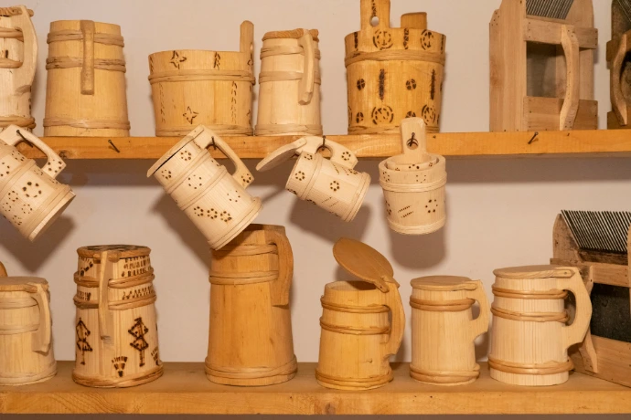 a shelf filled with lots of different types of mugs